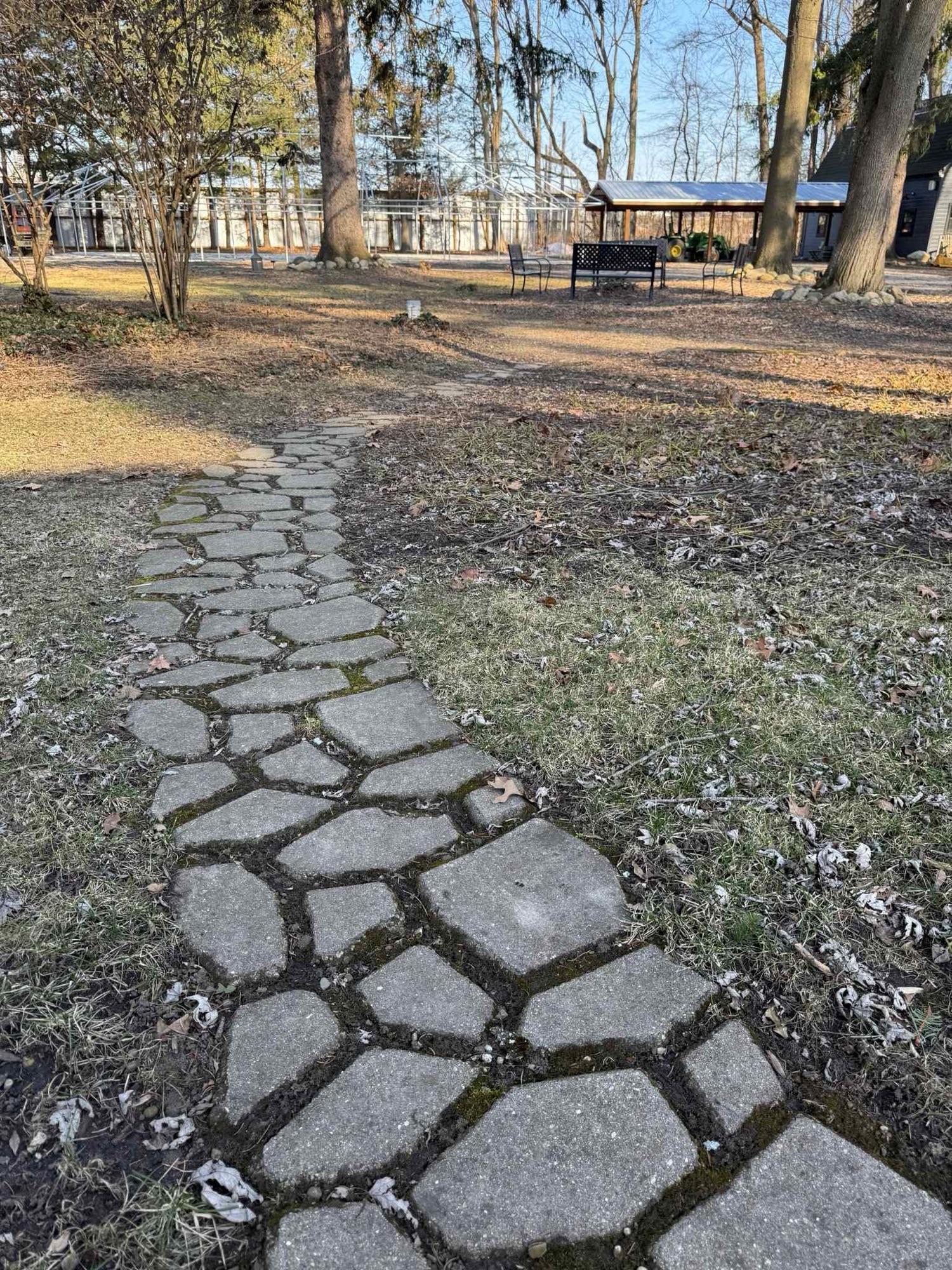 cobblestone trail leading to outside sitting area