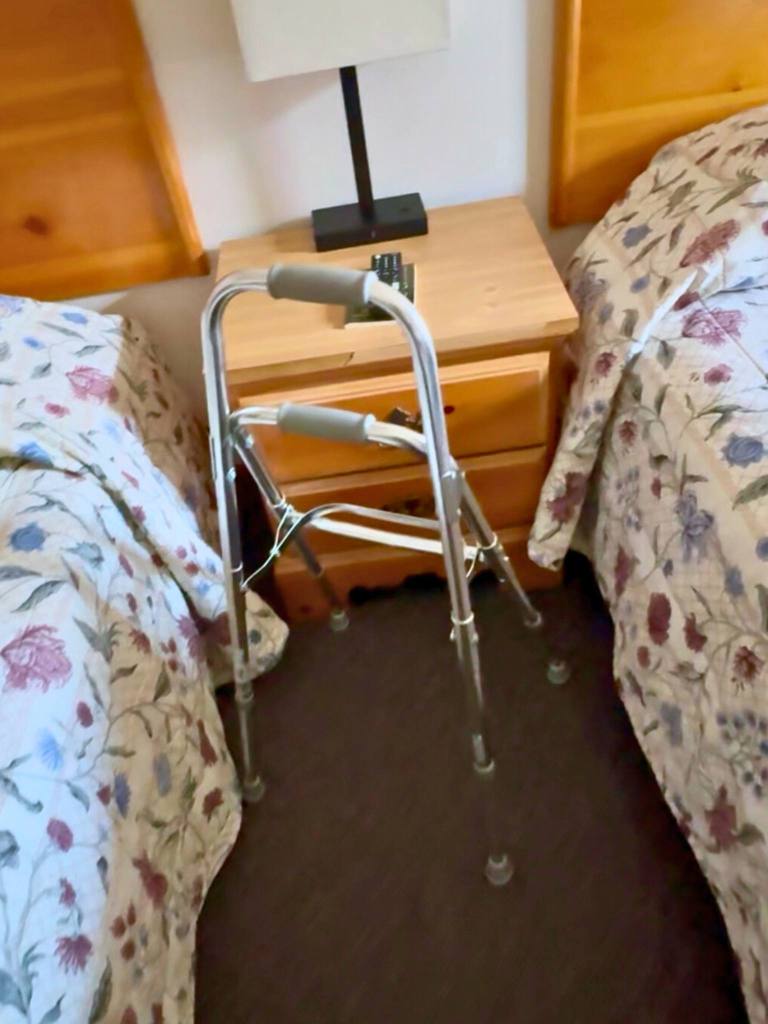 hemi walker shown setup in a hotel room between beds