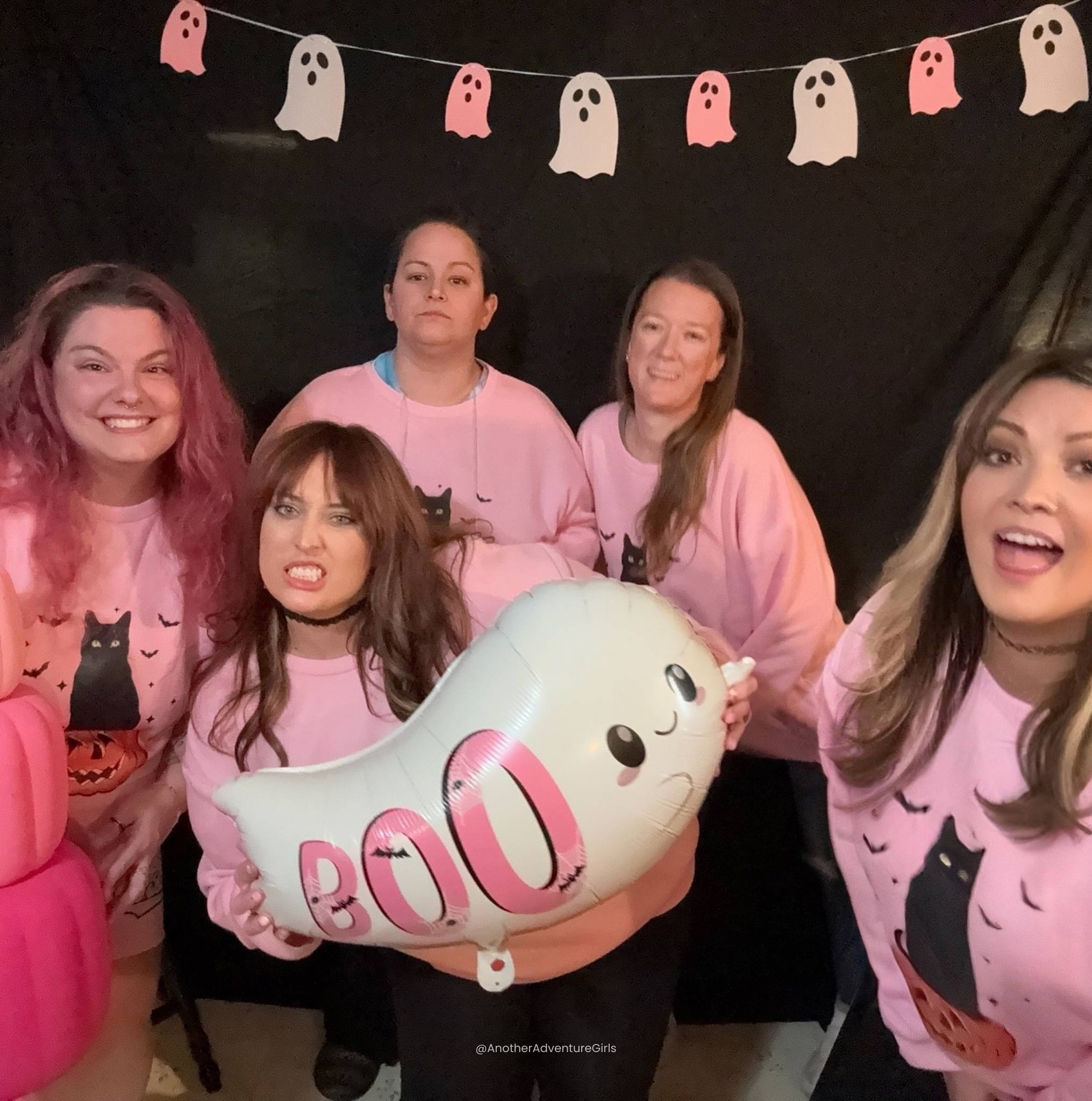 funny photo of five women in front of a black halloween background