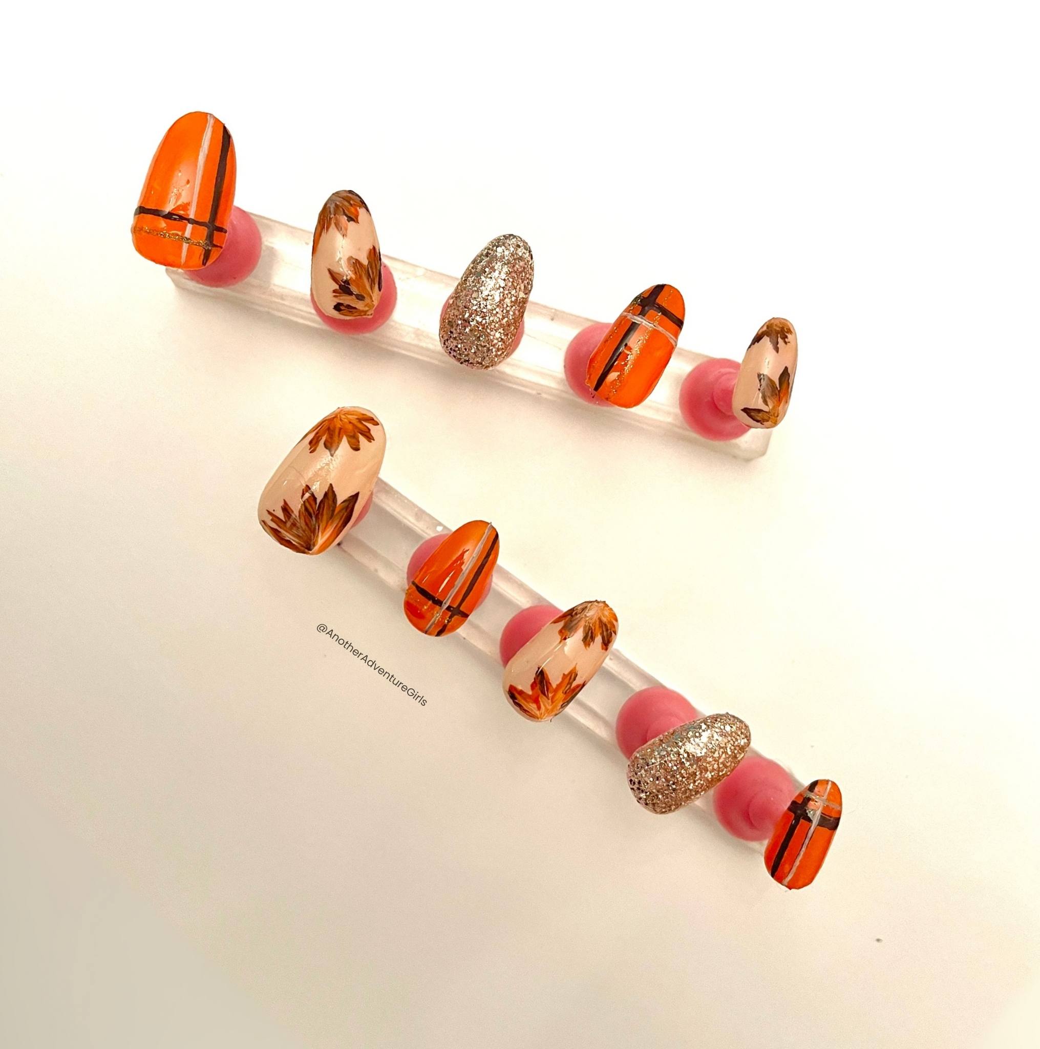 orange and brown leaf fall nail art design on diy press on nails