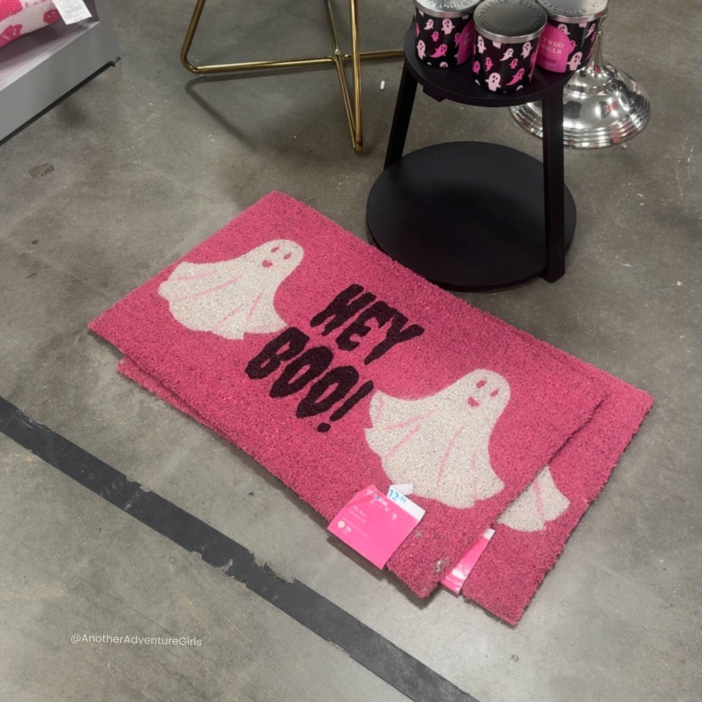 coir doormat painted pink with white ghosts and texts that says hey boo