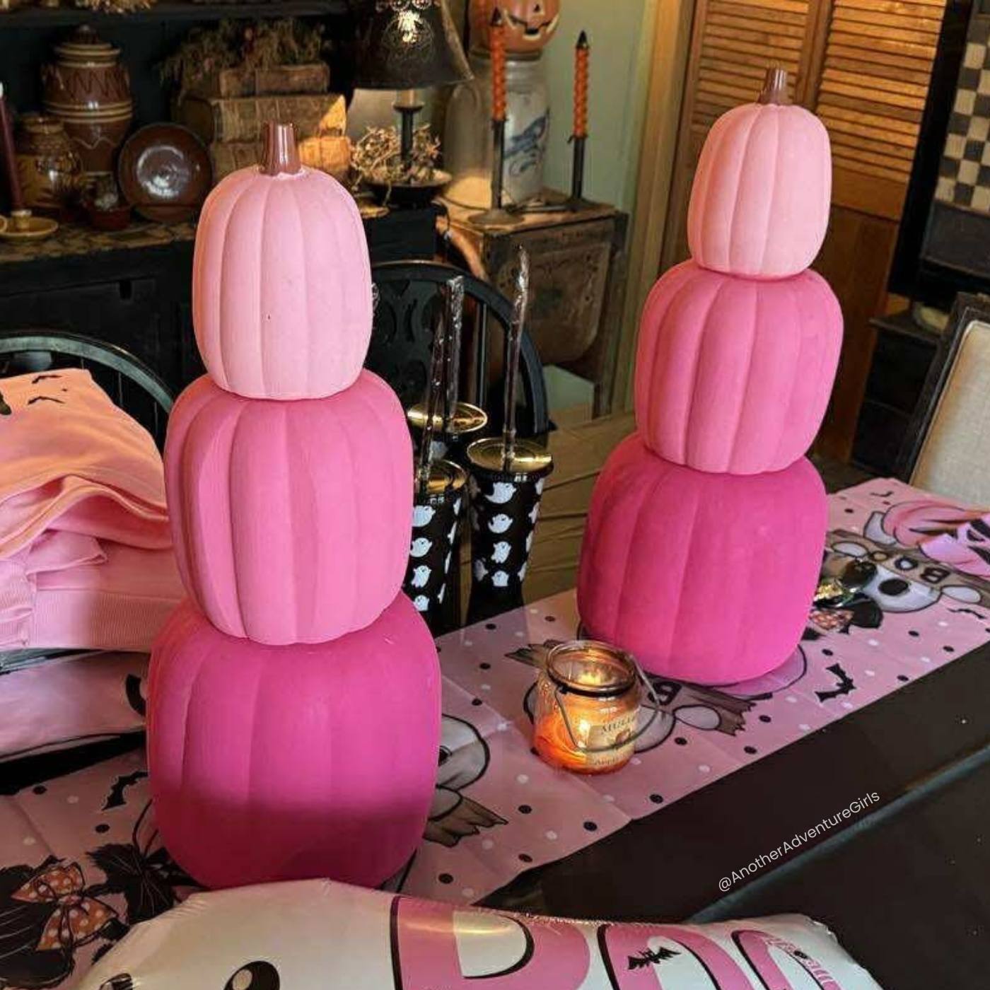 two sets of pink ombre pumpkins shown finished on a table