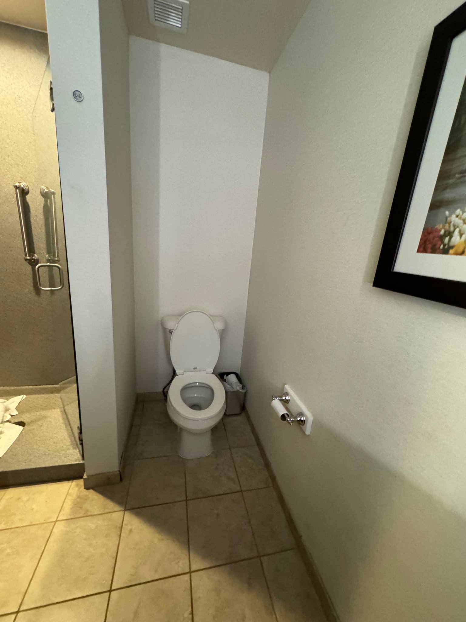 toilet inside bathroom of guest suite at bicycle street inn and suites