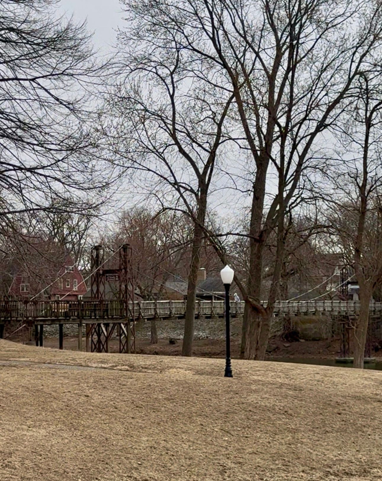 Humiston Park swing bridge on a cloudy day in the winter
