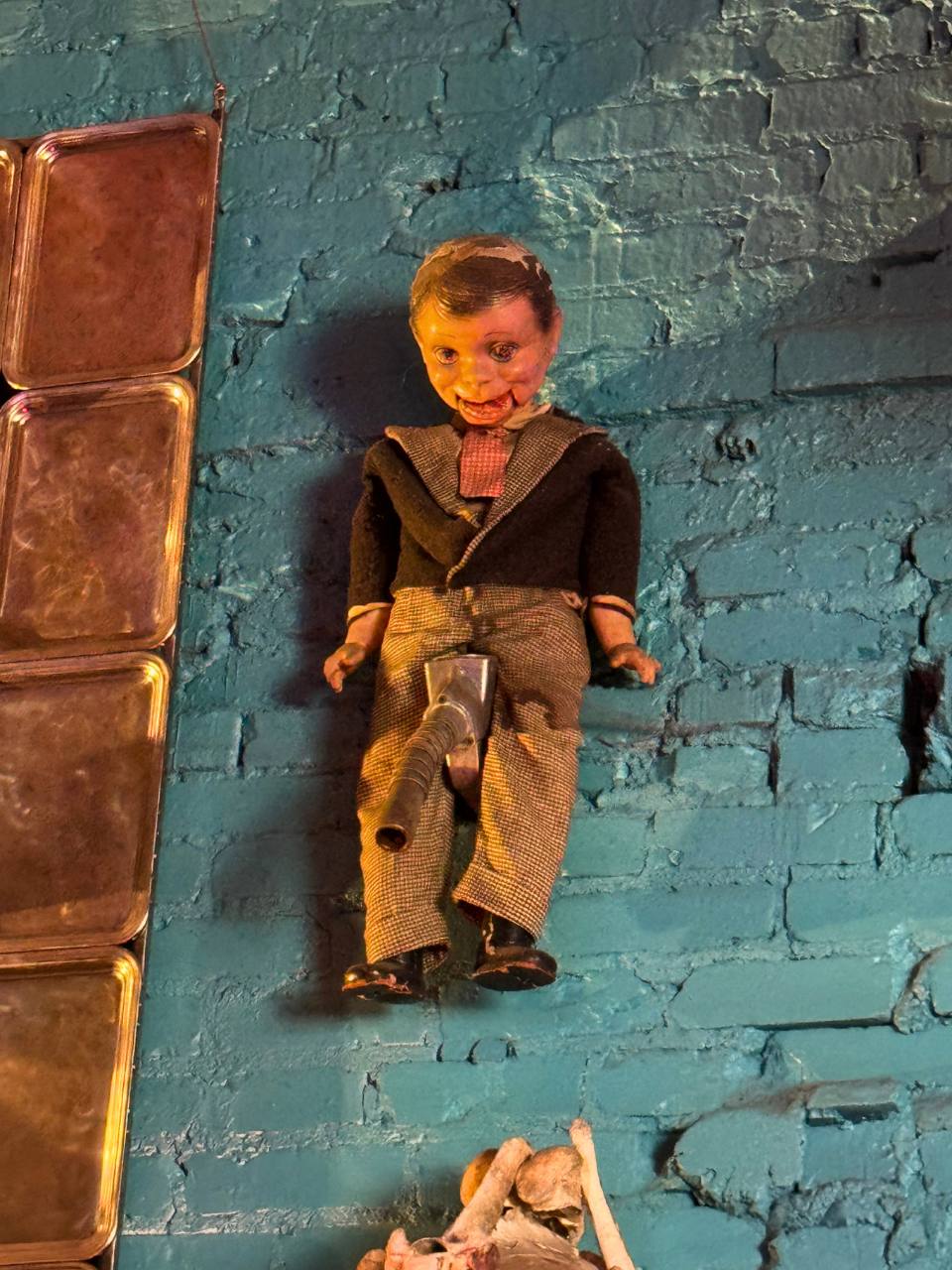 a puppet with a gas pump piece in place of private parts